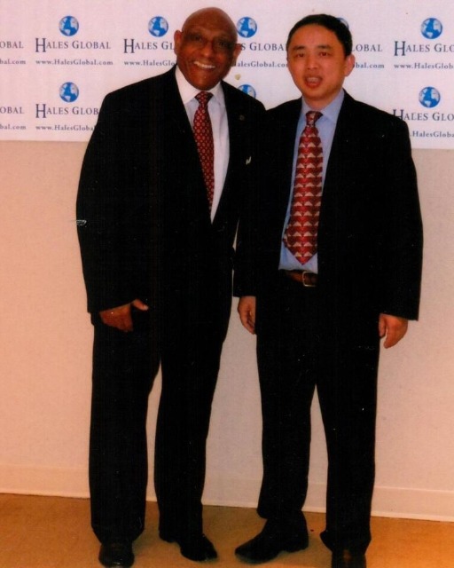 Hales Global press backdrop with international partner