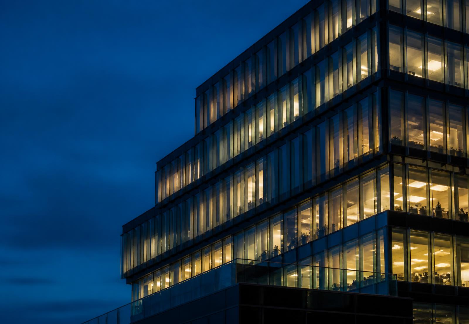 Consulting firm office building at blue hour